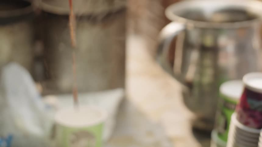Coffee being served in disposable cups