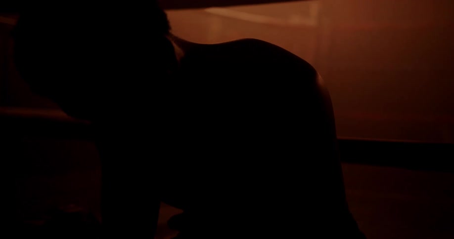 Silhouette of a person in a softly lit environment