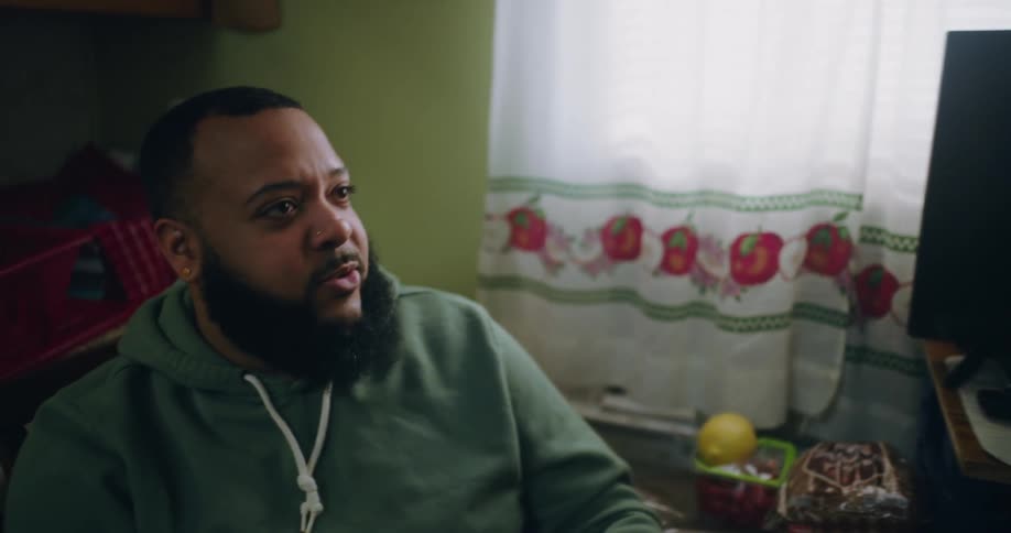 Bearded man sitting talking