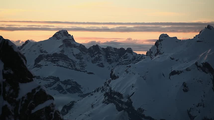 Snow covered mountains at dusk