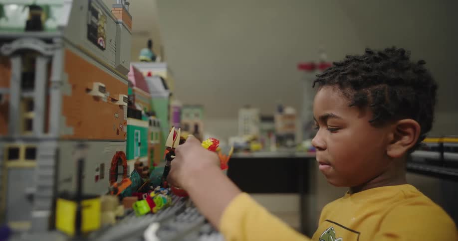 Boy playing with a lego figure