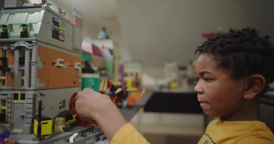 Child plays with a lego model