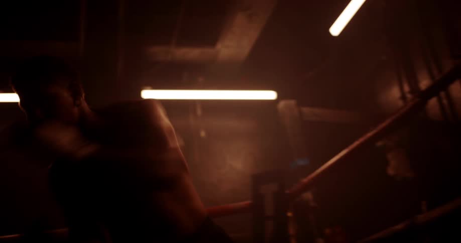 A boxer is shadowboxing in the ring
