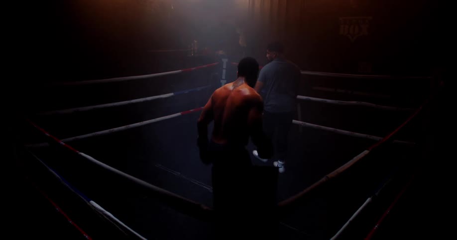 A boxer is practicing in the ring