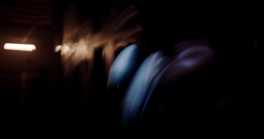 Man boxing in a lowlight environment