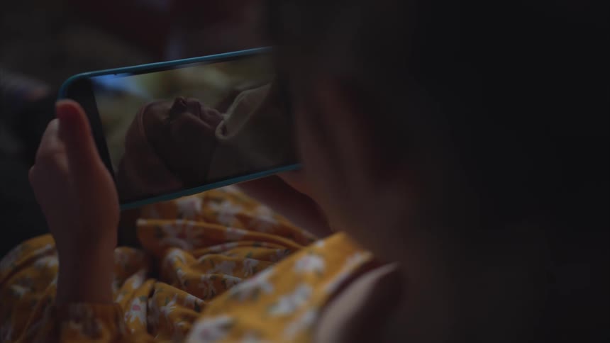 Child watching a video on a smartphone