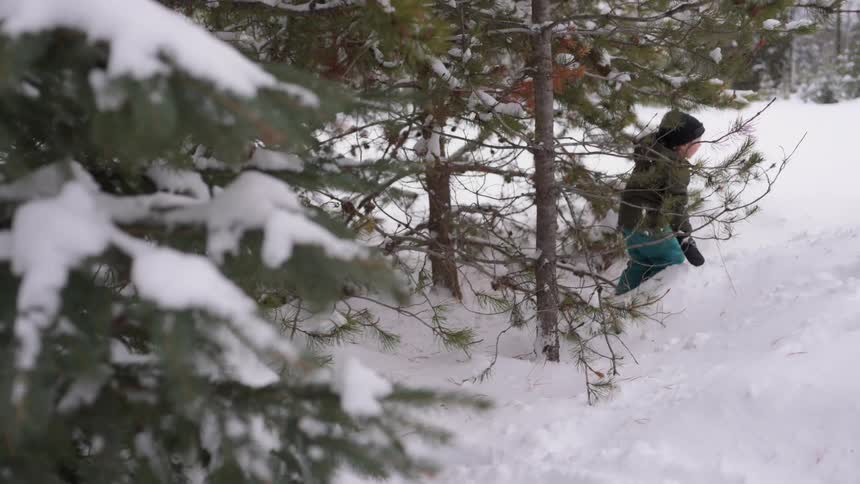 A child treks through the snow