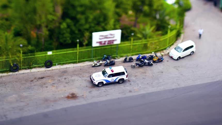 A police car has motorcycles pulled over