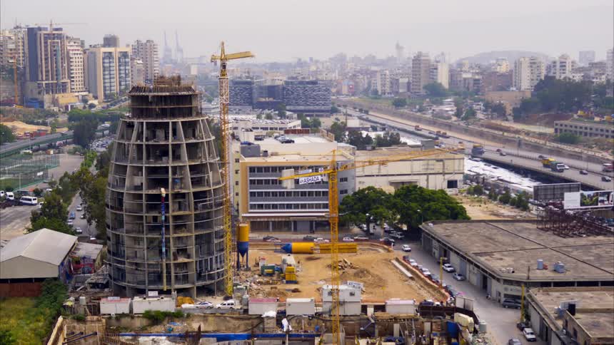 Traffic drives all around the construction site
