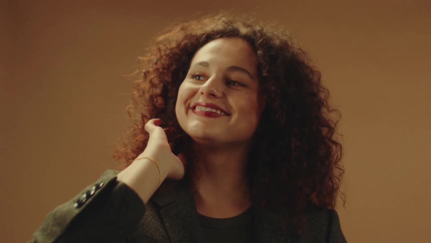 A model smiles and poses