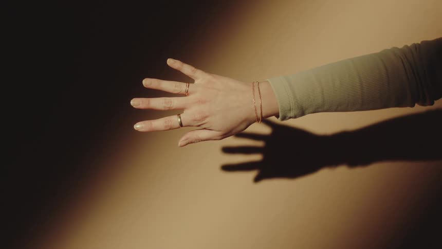 A woman reaches out her hand modeling jewelry