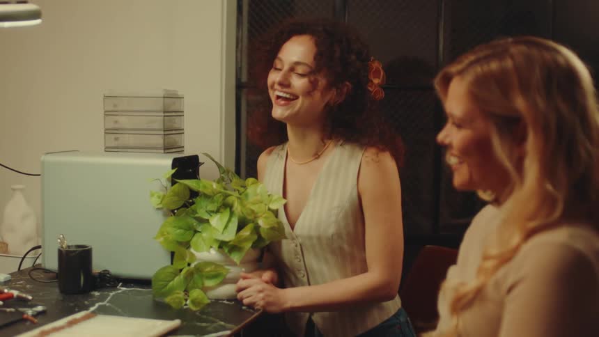 Two women are talking and laughing