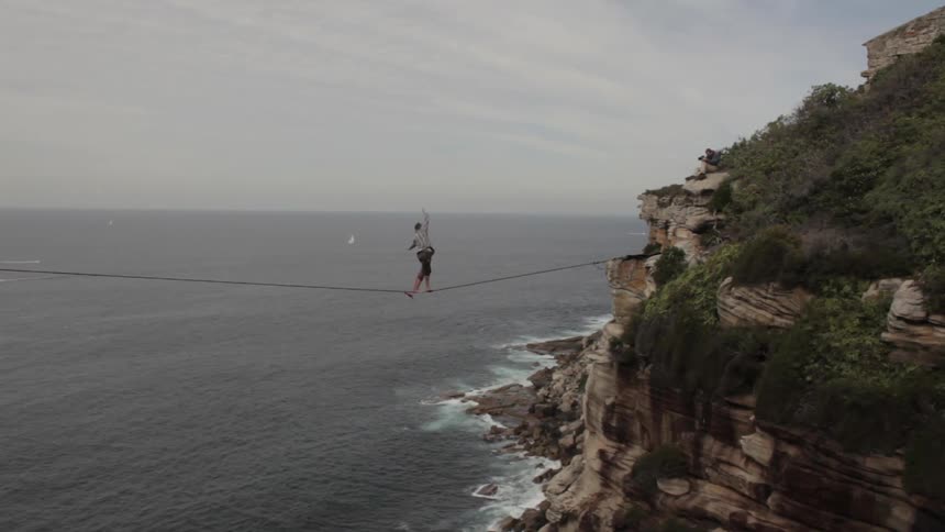 A person tightrope walking