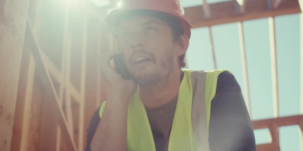 A footage of a worker having a phone conversation