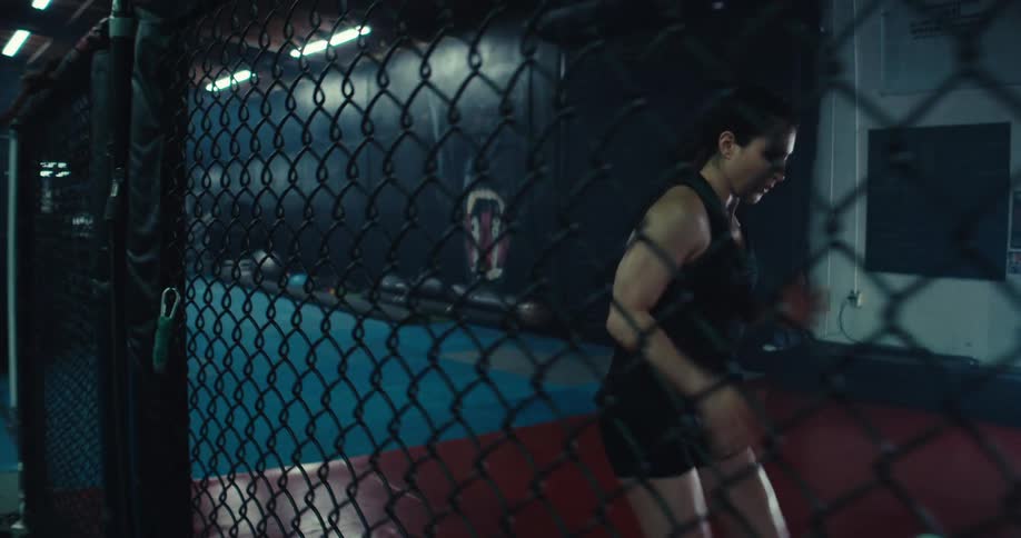 A woman is running in the gym