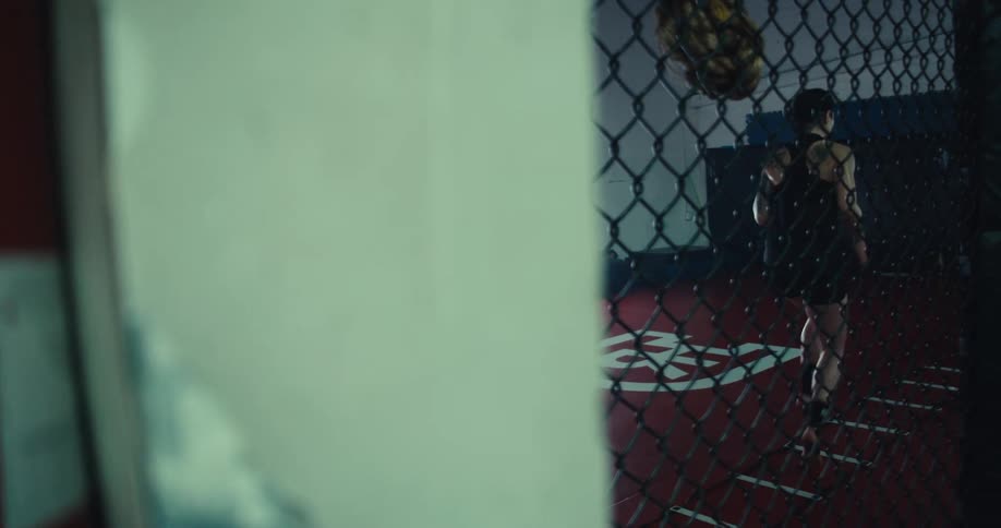 Woman warming up while inside a boxing ring