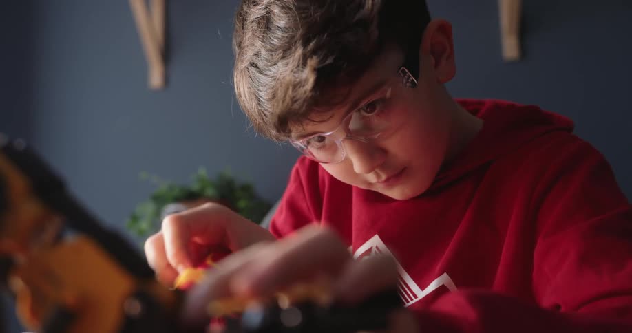 A clip of a kid working on a toy