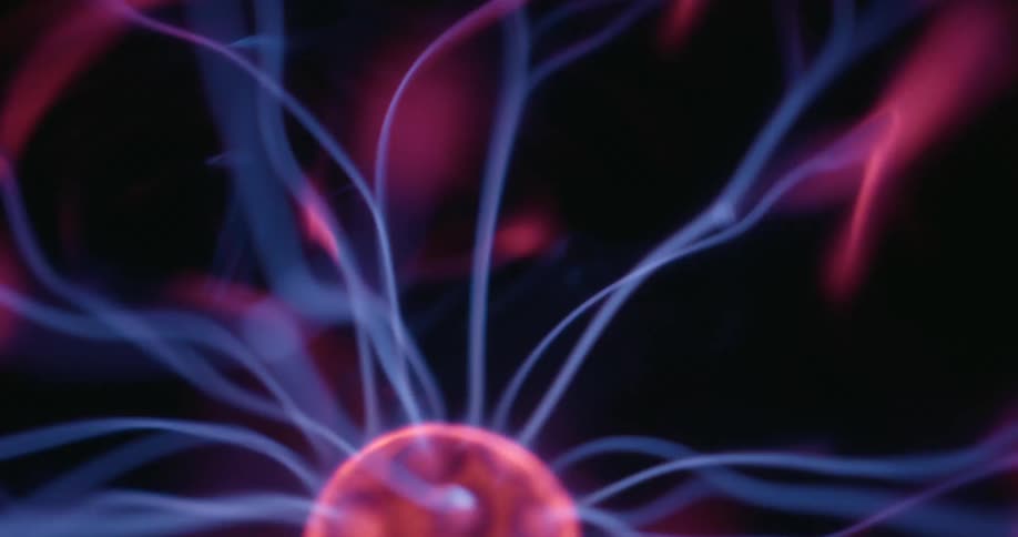 An orangepink plasma ball moving while generating blue streaks of light