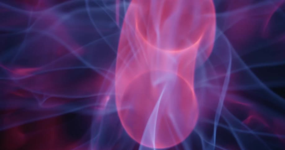 Amid a swirling array of neon arcs the center orb of a plasma globe shakes violently forming a motionblurred circle that flickers with pinkish and purplish hues against the dark background