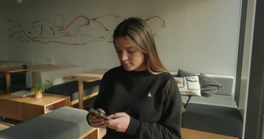A woman in a living texting