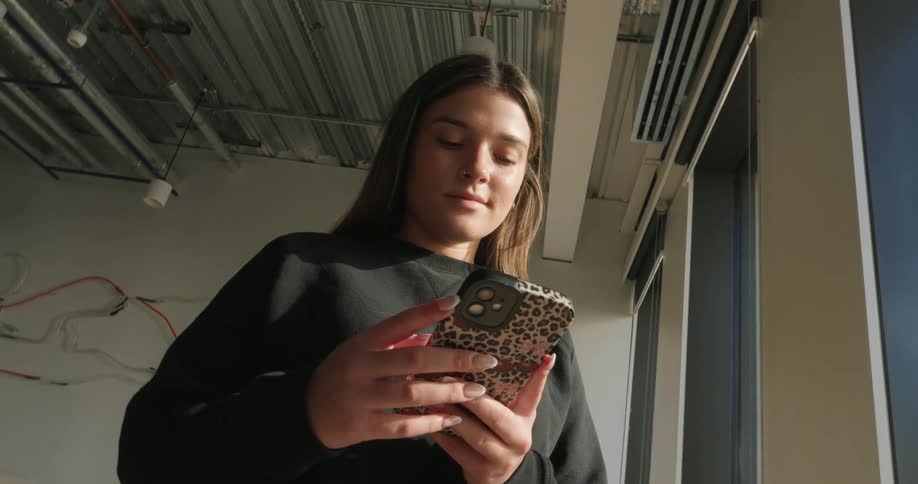 A footage a lady operating a smartphone