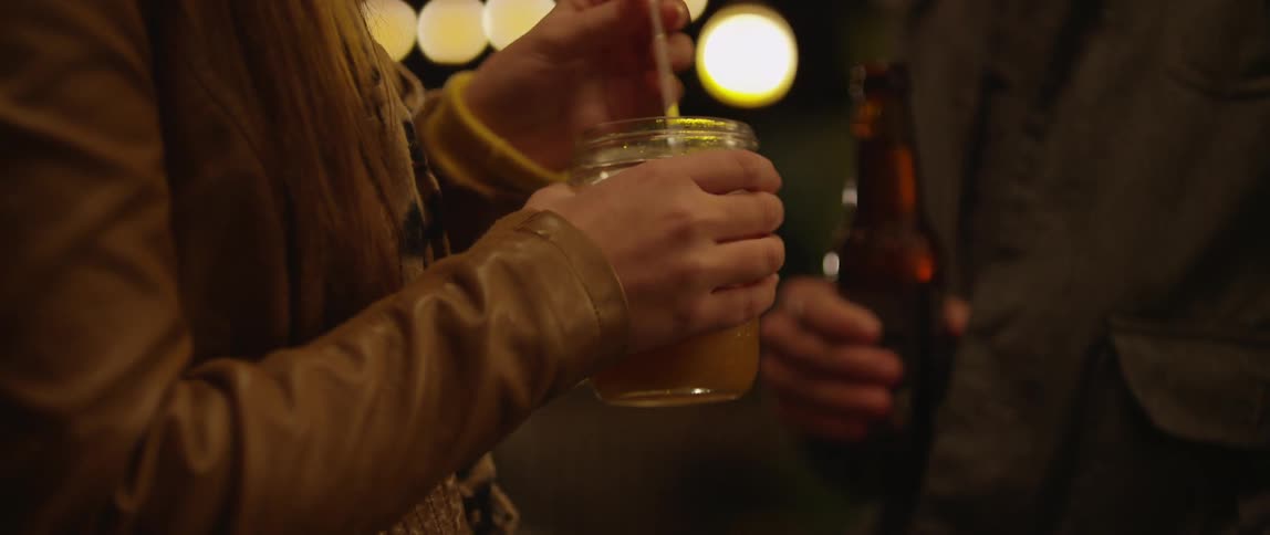 People enjoying drinks at night