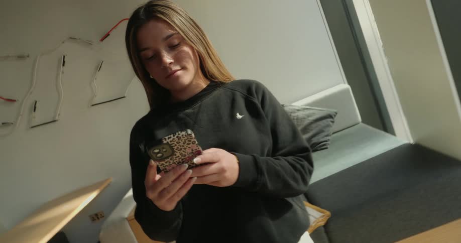 Woman typing on a smartphone
