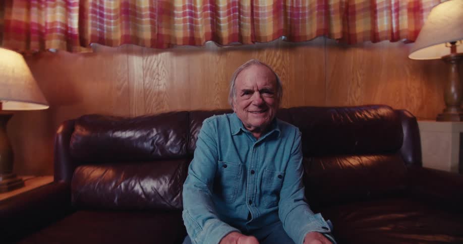 Elderly man having fun playing video games