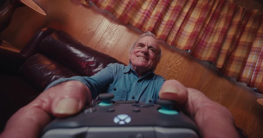 A man is playing video games at home