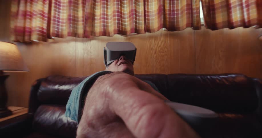 A close up footage of an elderly man playing a virtual reality