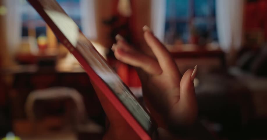 Female hand scrolling finger on a tablet