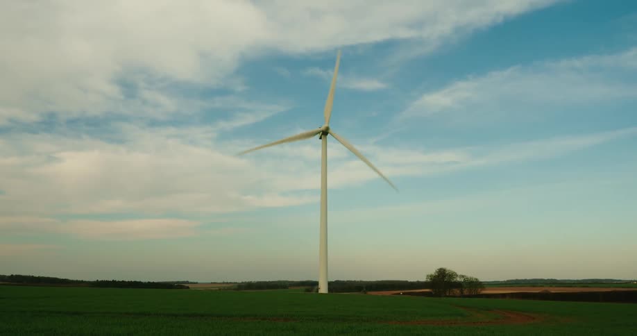 Turbine rotating clockwise generating electricity on a wind farm
