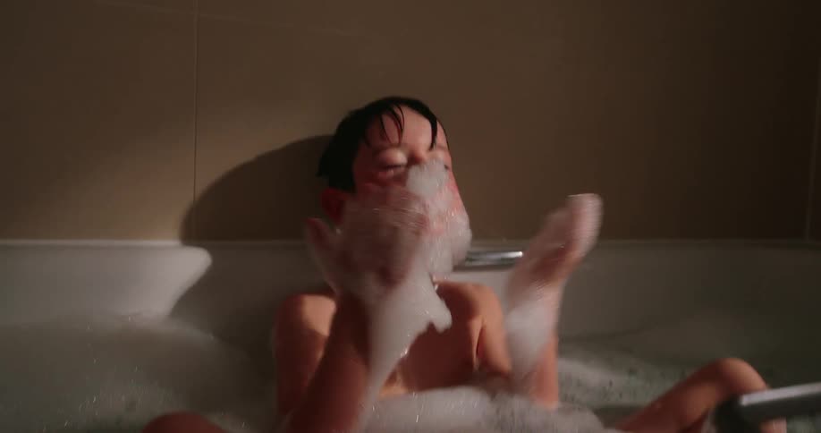 A clip of a boy playing in the jacuzzi