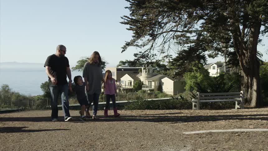 A family walking down a dirt path