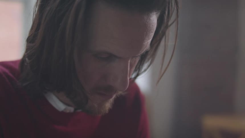 Man looking down thoughtfully