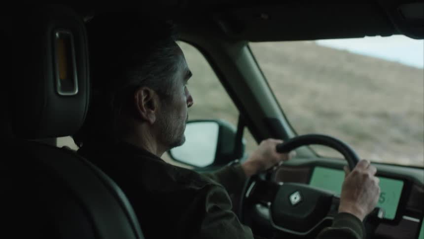 A clip of a man driving a car