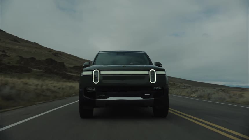 Closeup of a car passing on a mountain road