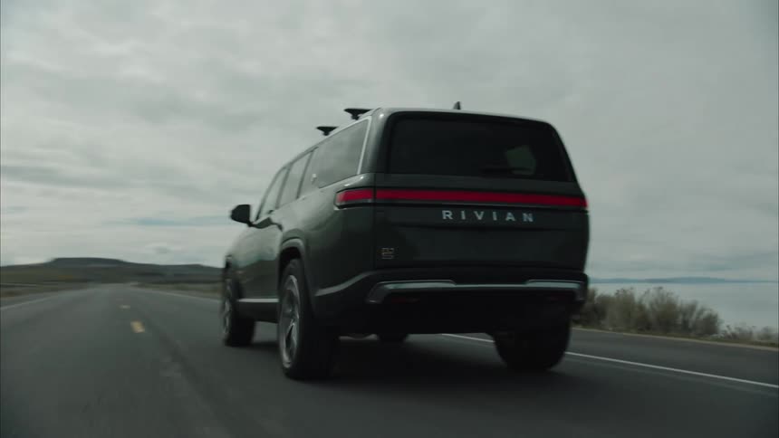 An suv drives down the road