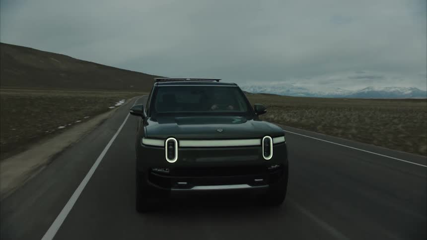 An suv drives down the road