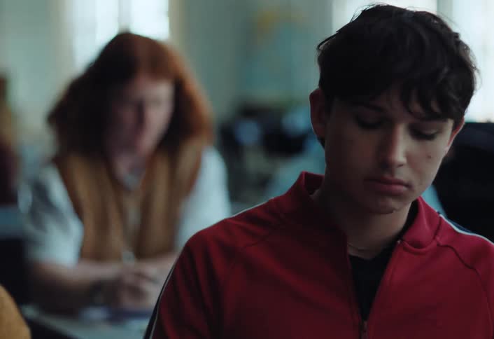 Guys at school one passes a note to another who is very confused by what is written on it