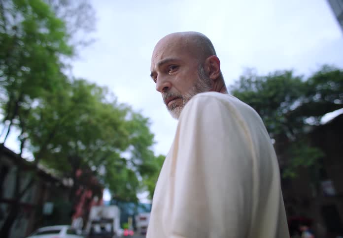 A man is standing in the road