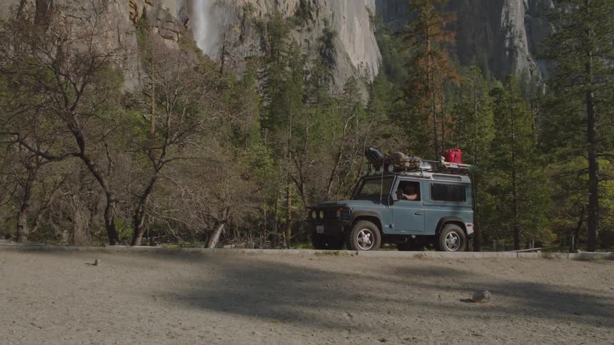 Jeep driving through the wilderness