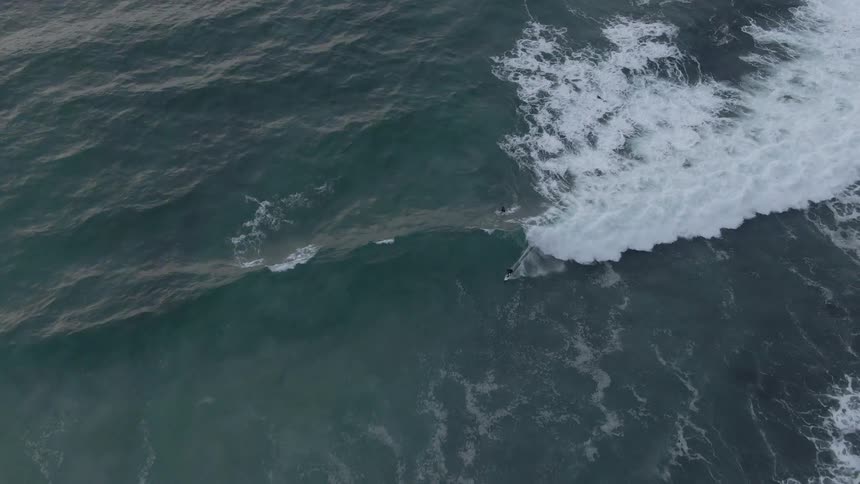 A wave slowly moves in the ocean