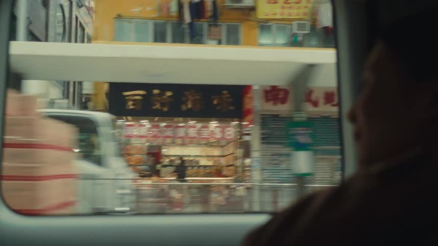 Woman inside a vehicle moving through the city