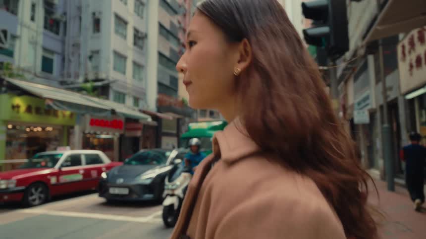 Woman crosses a downtown intersection on a winter day