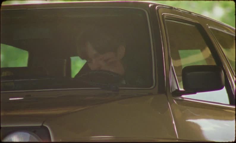 Man getting into a classic vehicle