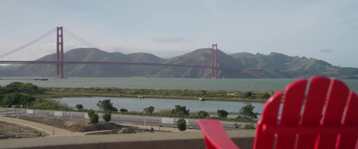 A large cable bridge is over the river