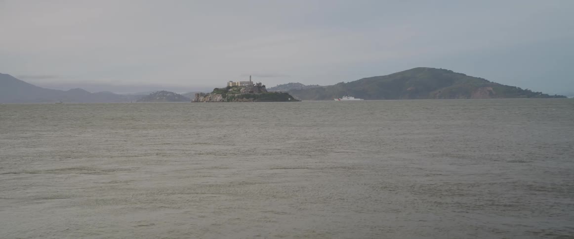 Ocean landscape with an island on the horizon