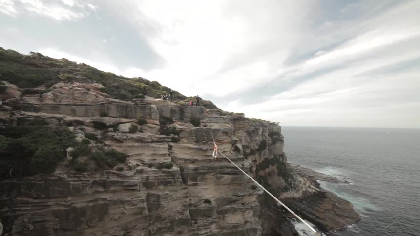 A person tightrope walking