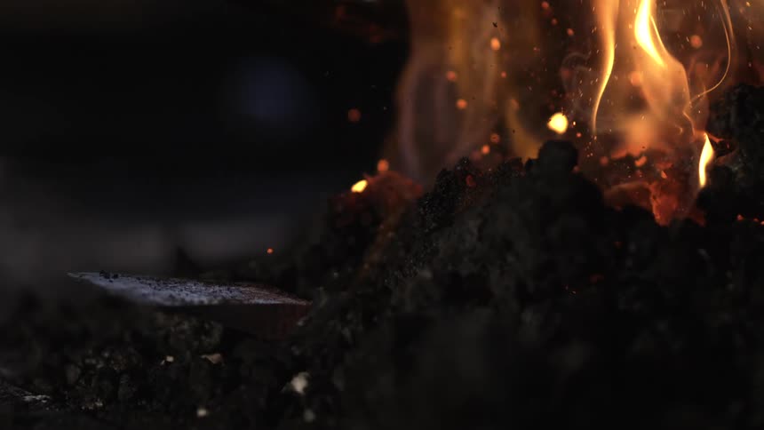 Fire eats at some wood